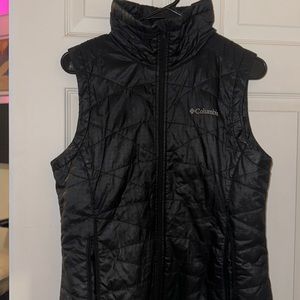 Columbia size M zip up reflective, waterproof, heat lined, vest.